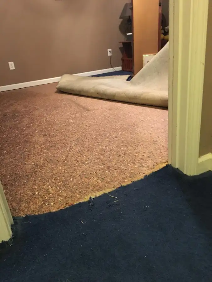 Carpet pad removal revealing water damage during Water Mitigation Services in Prescott Valley